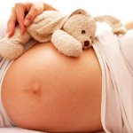 Why does the lower abdomen feel tight at 16 weeks of pregnancy?